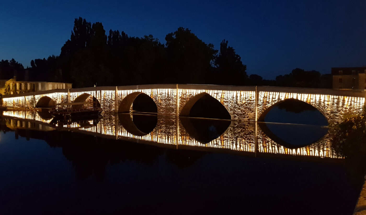 Old bridge lighting in Terrasson-Lavilledieu, France. Lighting design: Roger Narboni & Virginie Nicolas, CONCEPTO. Architect: Studio Patrick Ponsot. Photo copyright: Darlavoix.